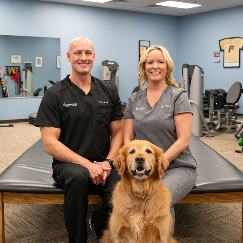Owners Dr. Mark and Dr. Kara with their Dog.